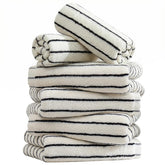 Qaxopl stripe towels draped on rack show compact, absorbent design for quick hand drying.