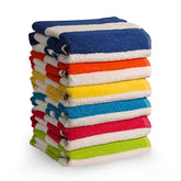 QUBA LINEN cabana stripe beach towel laid out for sun-ready lounging.