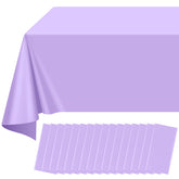 Ragnhild 16-pack light purple tablecloths laid out on a rectangular table for party setup.