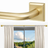 RBYCOS gold wraparound curtain rod blocks light gaps in a bedroom.
