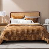 RECYCO luxury velvet quilt set in caramel gold folded on bed offers timeless elegance.