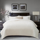 RECYCO luxury velvet quilt set in cream white folded on bed, inviting chic appeal