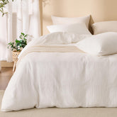 RENEWROOTS off white duvet cover in queen size on bed shows soft sandwashed cotton finish