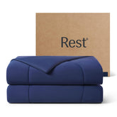 REST Evercool cooling comforter midnight blue folded for compact storage and quick cooling.
