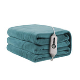 ReyyNio heated blanket on a sofa for cozy evenings