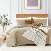 ROARINGWILD beige cloud twin quilt on bed for cozy all-season comfort.