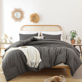 ROSGONIA queen comforter set in charcoal gray on a cozy bed for all-season warmth