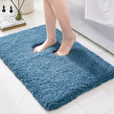 Ruggnovea non-slip blue bath rug for secure footing after showers.