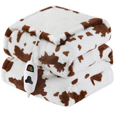 RUJIPO Heated Blanket Throw on a sofa showing cow-print design and quick warmth