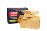 Rutland Fire Bricks tan 6-pack seen in a firebox for replacement.
