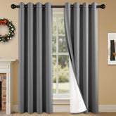 SABALANICA 2-panel blackout curtains in charcoal grey blocking light for windows