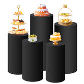 SaitiMade black cylinder pedestal cover on a white stand creates an elegant event focal point.