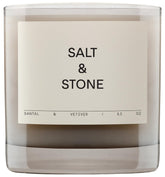 Salt & Stone Santal & Vetiver candle in glass jar, warm ambience.
