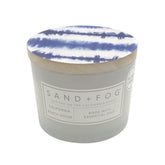 Sand + Fog California Beach House candle in a glass jar with decorative lid, ideal for gifting.