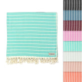 Sand Cloud Gocek Mint sand-free Turkish towel on the beach.