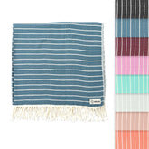 Sand Cloud Turkish Beach Towel Gocek Denim on sand, a portable, sand-resistant beach scene.
