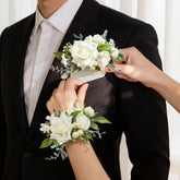 Serwalin white rose corsage wristlet with lifelike petals for lasting elegance.
