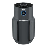 Shark NeverChange Max purifier in living room demonstrates large-room air purification.