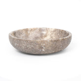 Shelf & Nook travertine white bowl on entryway table adds natural elegance and practicality.