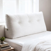 Shuyeon wedge headboard pillow on twin bed offering back support.