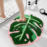 Sisher Monstera leaf bath mat with palm shape and plush pile for cozy feet.