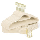 Sishynio velvet hangers with gold hooks cradle a beige dress, preventing slips and wrinkles.
