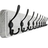 SKOLOO wall-mounted coat rack in weathered white showing rustic entryway appeal
