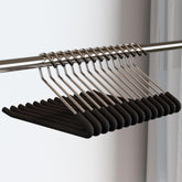 SLMT open-ended pants hanger enables easy add/remove without removing from rod