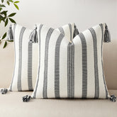 Smile Bee boho striped pillow cover with tassels enhances sofa decor.
