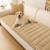 Smiry couch cover on a camel sofa protects furniture while your dog relaxes.