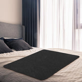 SmoothNovelty couples waterproof blanket, black bed protector, prevents spills on shared beds.