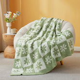 Snuggle Sac checkered flower throw in sage green for couch comfort and warm vibes.