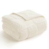 Snuggle Sac checkered throw with faux fur texture elevating cozy living room decor.