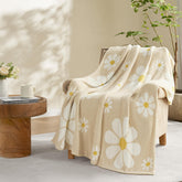 Snuggle Sac Flower throw on sofa shows plush microfiber texture for cozy evenings