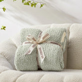 Snuggle Sac heather sage green throw, reversible knit for versatile styling and warmth.
