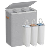 Songmics three-compartment laundry basket for easy clothing sorting.