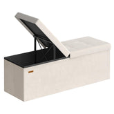 SONGMICS Mazie 43-inch ottoman with folding lid offering quick access to stored items.