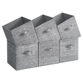 SONGMICS storage cubes with double handles for easy shelf transport.