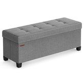 SONGMICS storage ottoman bench with foldable legs for versatile seating