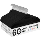 SONGMICS velvet hangers in ink black showcasing compact space-saving design for organized closets.