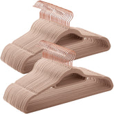 Songmics velvet hangers with rose-gold swivel hooks keep outfits organized and secure.