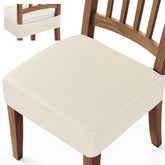 Songrey waterproof seat cover on a dining chair, front view, beige color, spill protection.