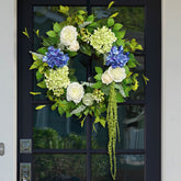 Soomeir hydrangea wreath on front door adds vibrant curb appeal.