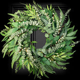 Soosubel 22-inch eucalyptus wreath on front door for year-round curb appeal.