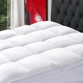 SOPAT mattress topper on a king bed showing full size and plush surface.