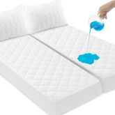 SPRINGSPIRIT split-king protector flat view showing waterproof quilted surface for spills