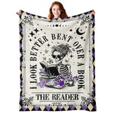 Sruemiul skeleton reading blanket closeup shows gothic design for cozy nights.