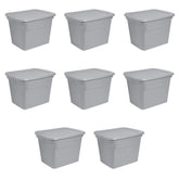 Sterilite 18-gallon tote with lid stores clothes securely for organized storage.
