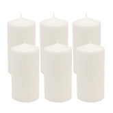 Stonebriar unscented white pillar candles glow softly for calm evenings.