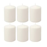 Stonebriar unscented white tall pillar candle in a lantern for warm ambience.